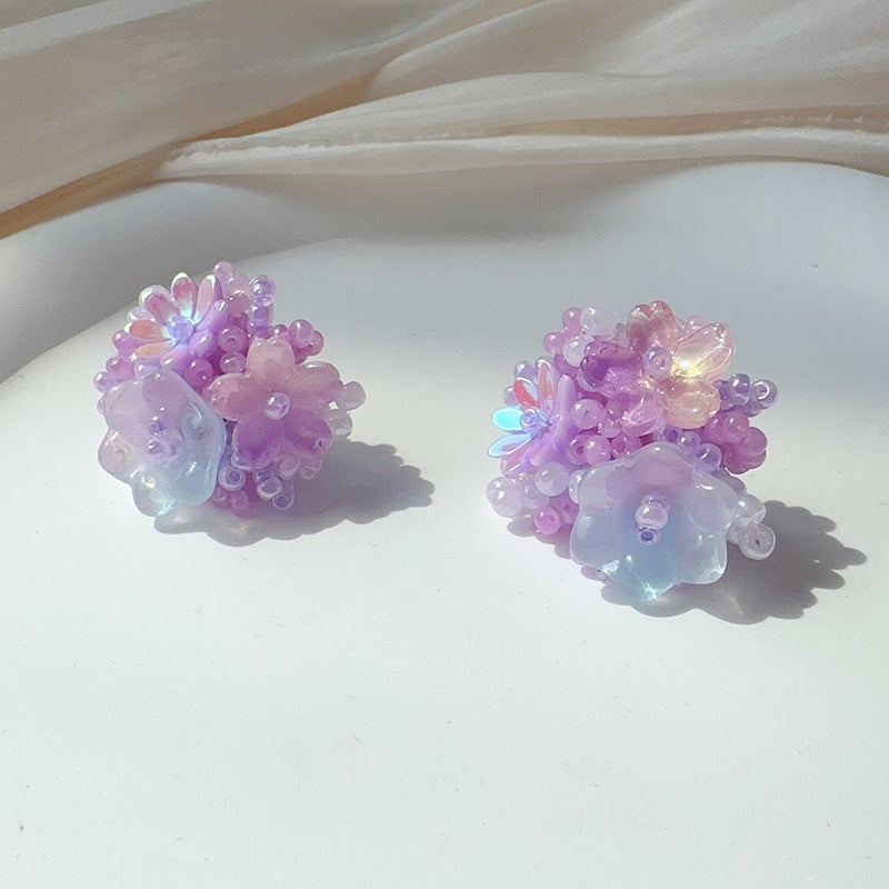 "Purple pearly flower earrings with enamel petals and pearl center – lightweight floral studs for festive and everyday wear"